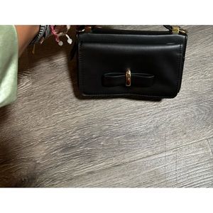 Black bow bag with gold accents